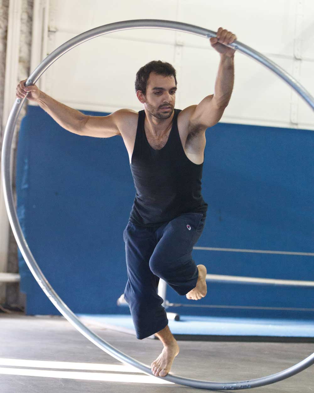 man training on cyr wheel